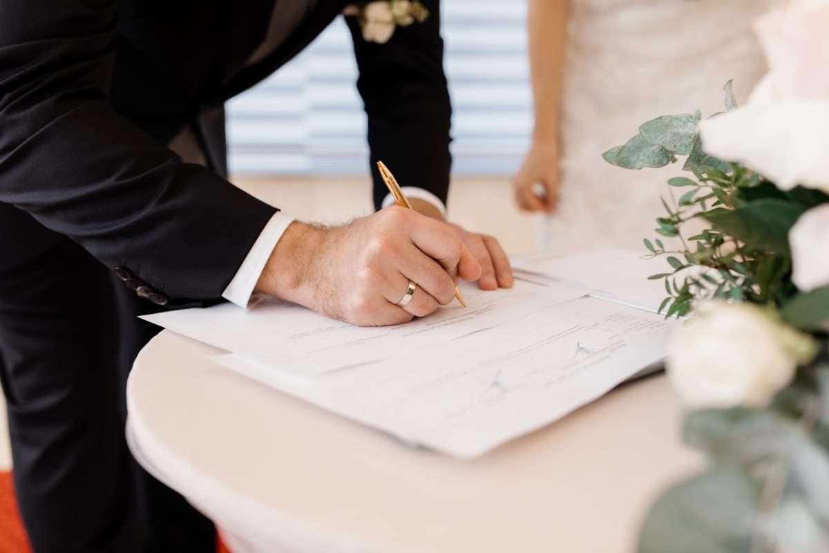 Couple in love is signing official marriage documents