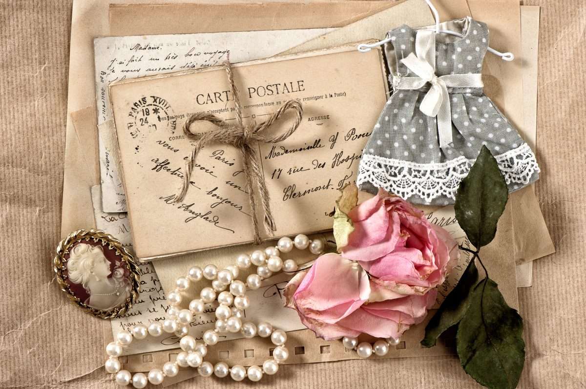 old letters, postcards, dry rose flower and vintage things