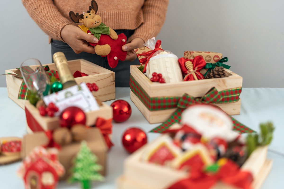 Woman preparing boxes of Christmas presents