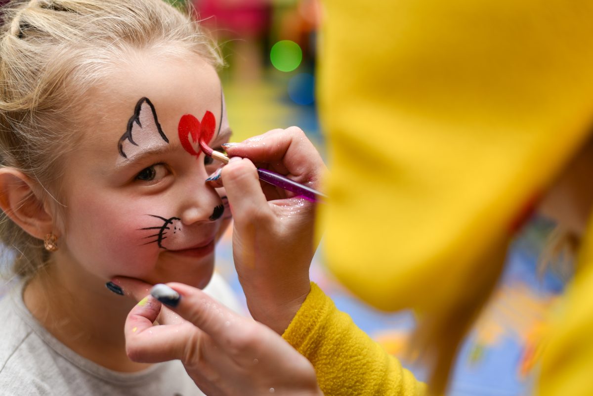 The animator paints the face of the child